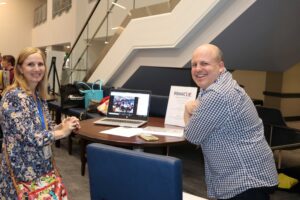 Two educators at a table-top demonstration in the Educator Showcase