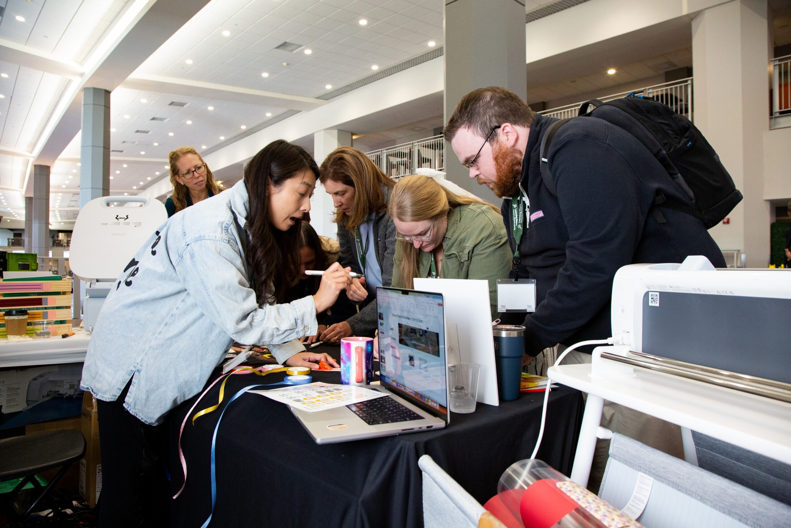 2024 Fall Conference attendees visit exhibitor presentation, cricut