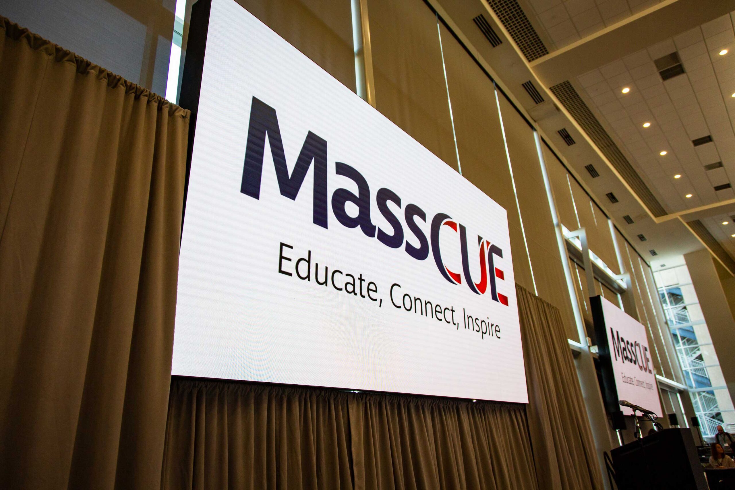 MassCUE logo on big screen at Fall Conference